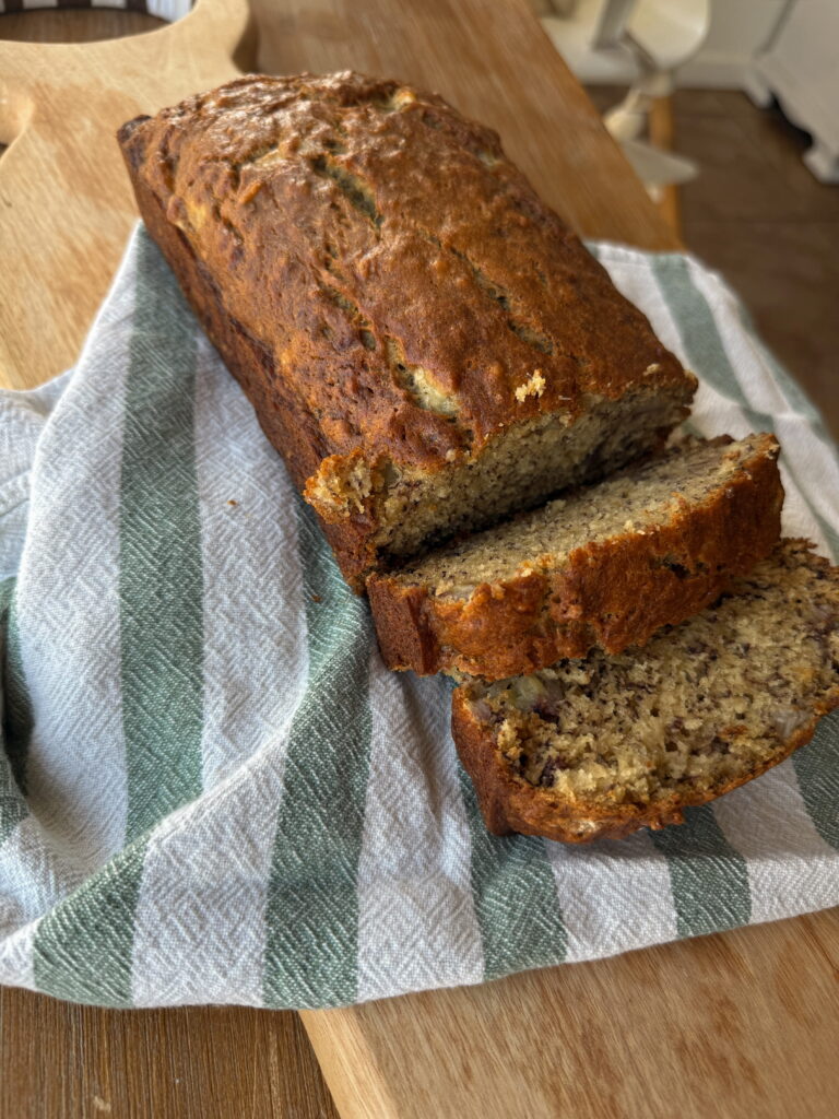 Sliced banana bread on striped towel
